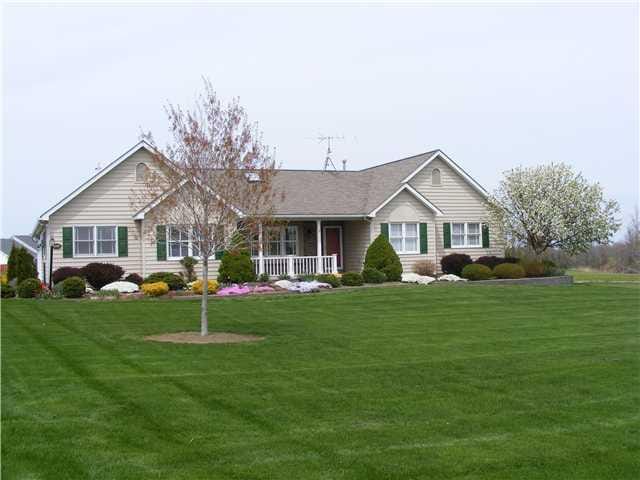 Exterior Front. The home sits off the road offerin
