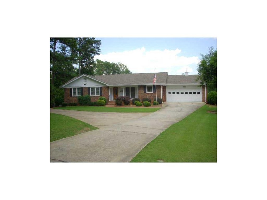 Exterior Front. Four sided brick home on level acr