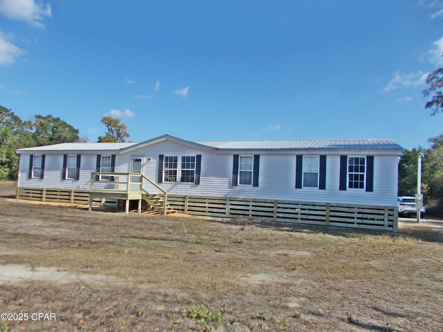 6905 Bateau Pond Rd, Grand Ridge, FL 32442 - photo 1