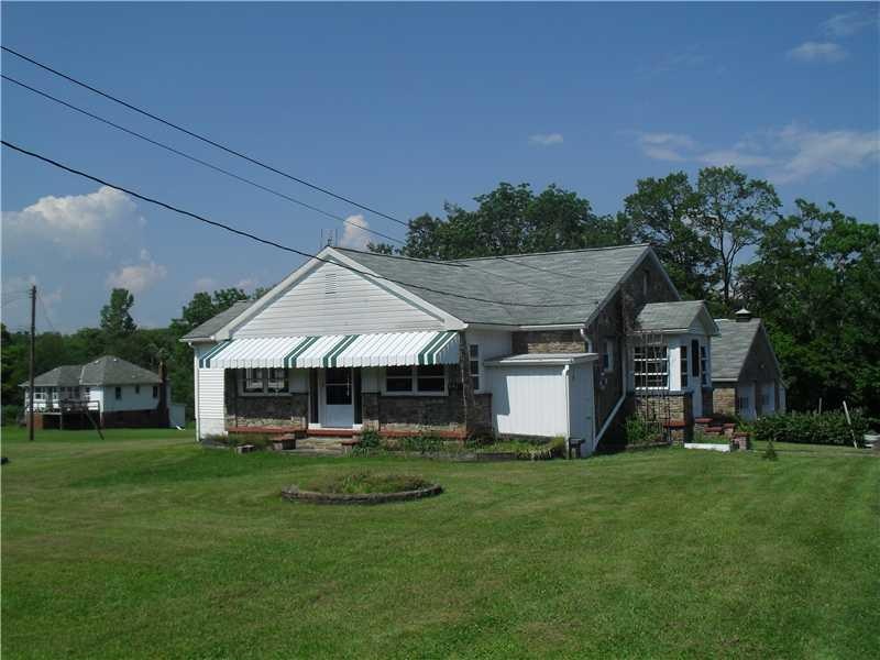 Exterior Front. Level 1.2 acre lot