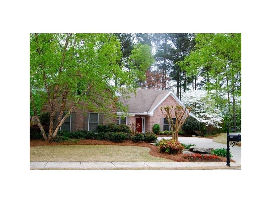 Exterior Front. Side entry garage and extensive la
