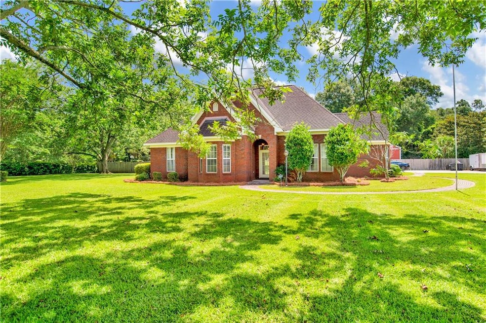 Traditional home featuring brick siding and a shingled roof