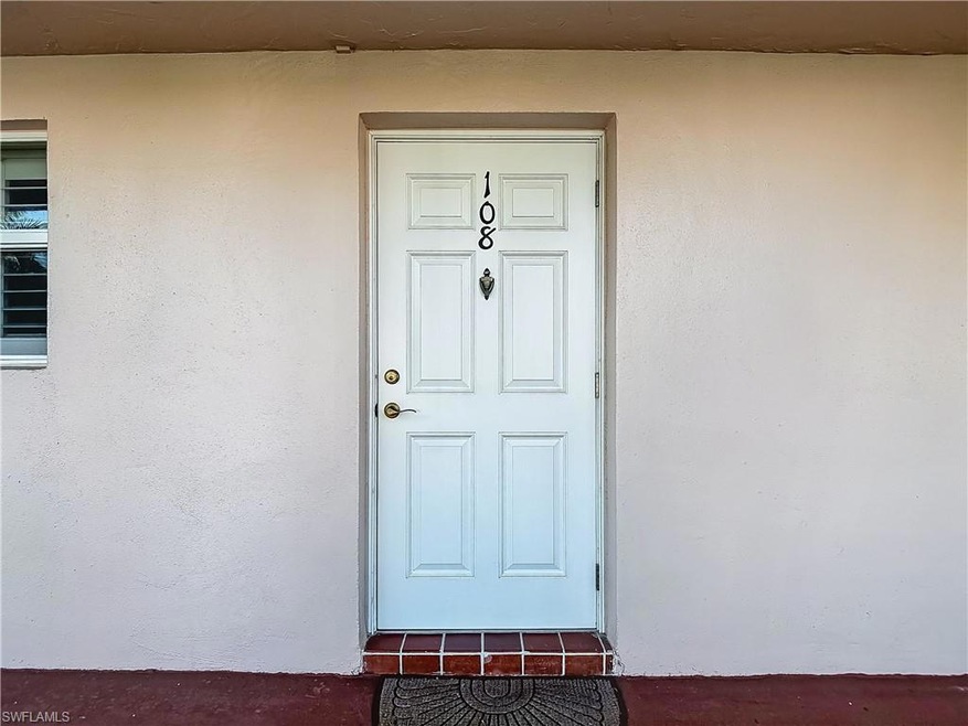 Property entrance featuring stucco siding