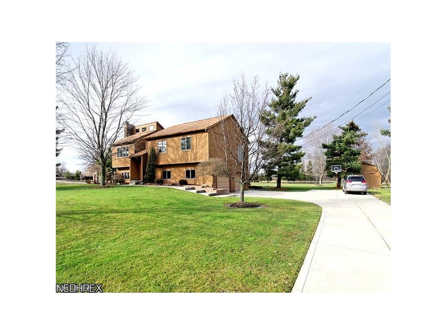 2,100-sqft bi-level with clerestory windows in a large great room (top-left). Andersen windows throughout. Side-entry garage with turnaround (at basketball goal).