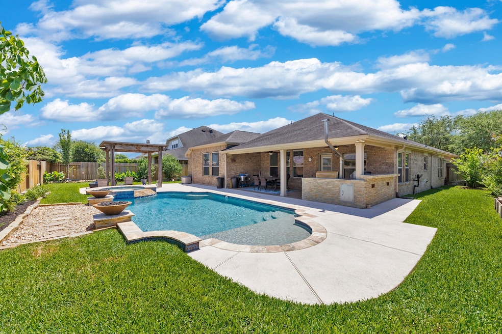 Enjoy your own private oasis that includes large pool, spa, outdoor kitchen and plenty of shaded seating areas.