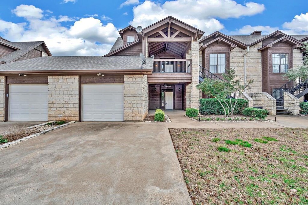 Front view of property. Second floor unit with one