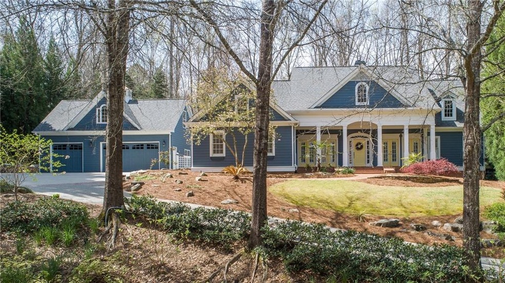Cape Cod style home situated on 1.4+/- wooded acre