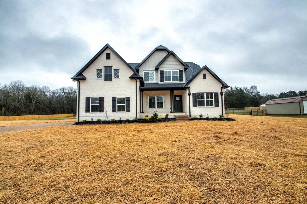 Stunning Daniel plan by Fleming Homes features all the extras and sits on 1.5 acres near town!