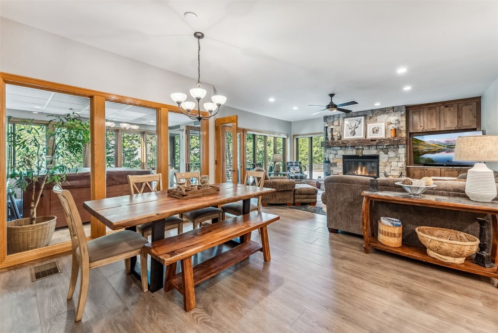 Dining space with a fireplace, ceiling fan with no