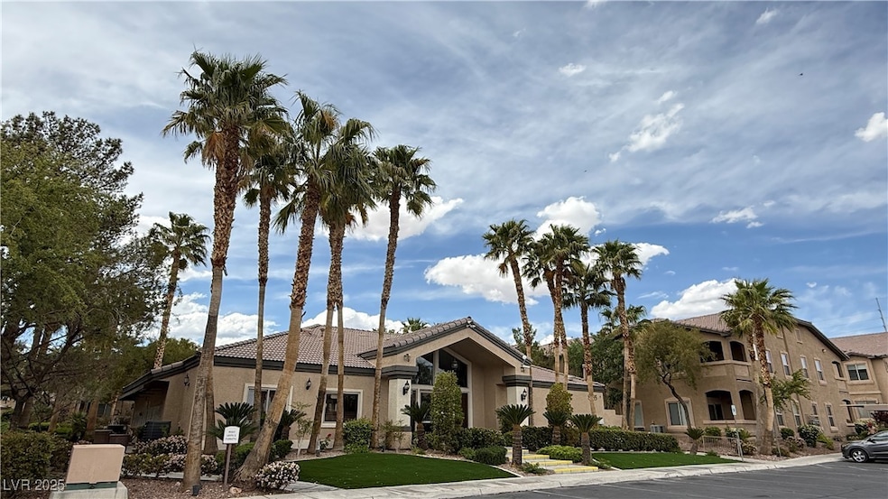 View of front of property with a tile roof and stu