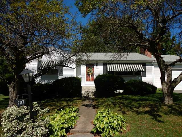 Exterior Front. Nicely landscaped front yard