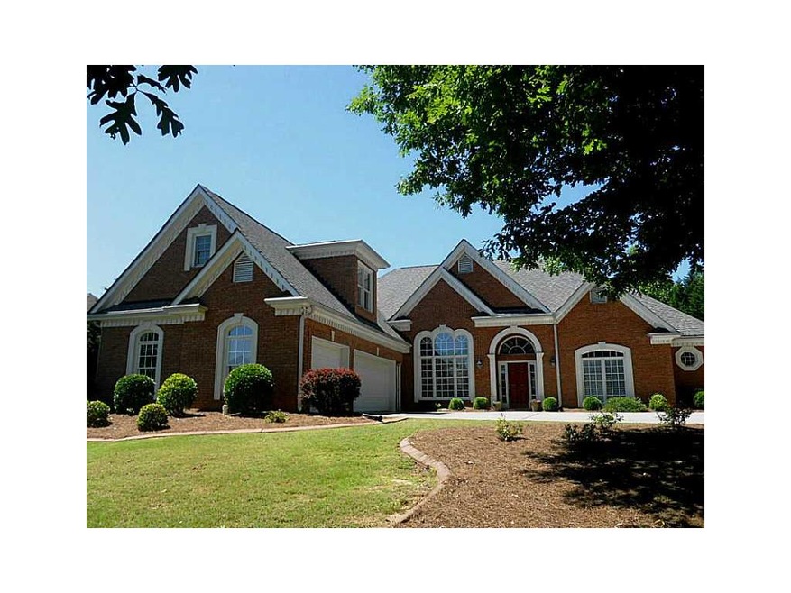 Exterior Front. 4 Sided Brick Ranch.  3 Car Side E