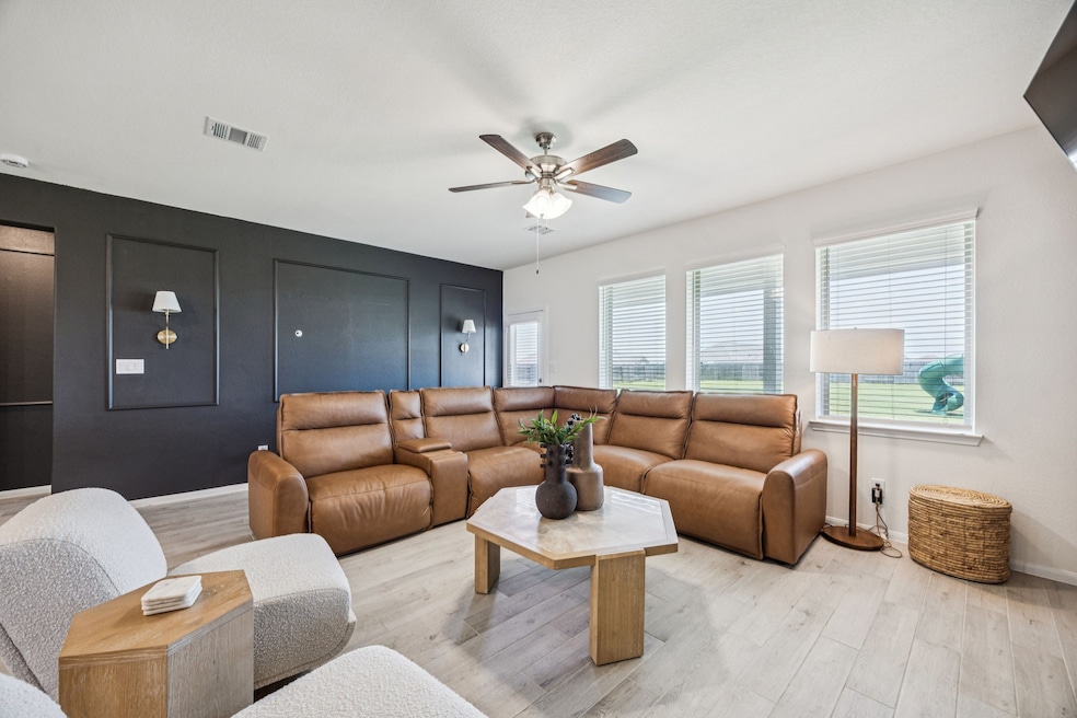 Another view of the living room. The cozy couch br