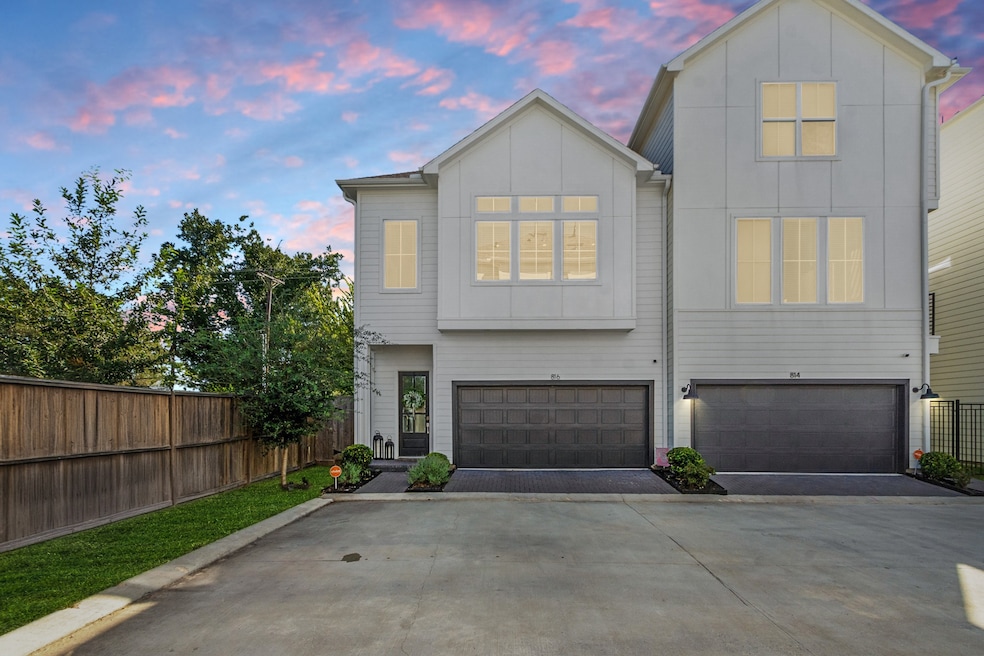 This modern corner-unit townhome located in Timbergrove has no side neighbors and two extra parking spaces right in front.