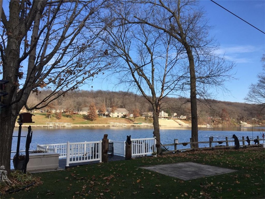 Waterfront view, mature trees, maintenance free ra