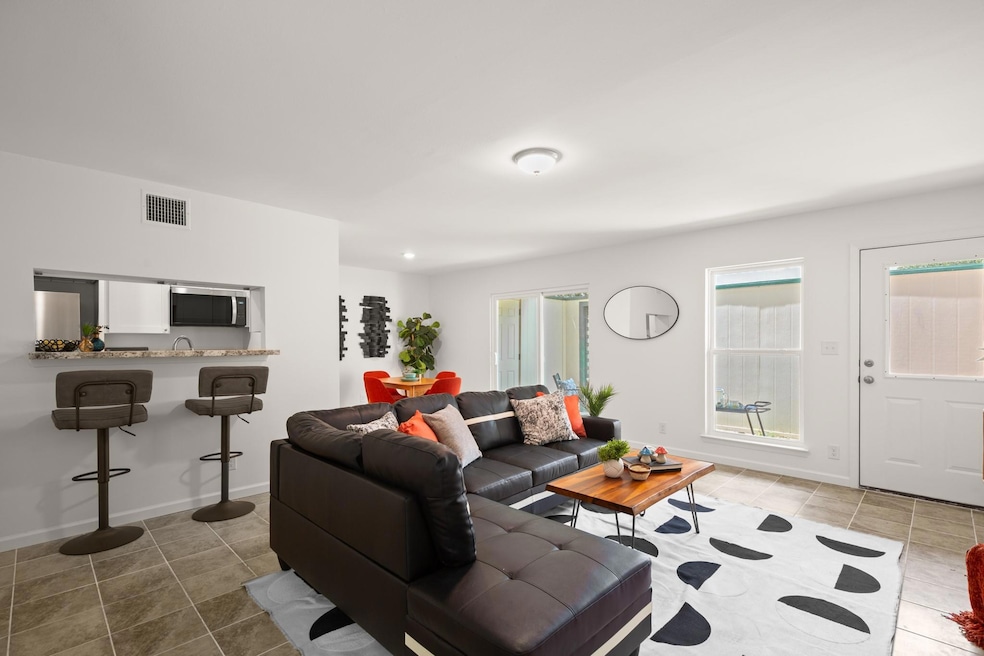 Living room featuring tile patterned flooring and