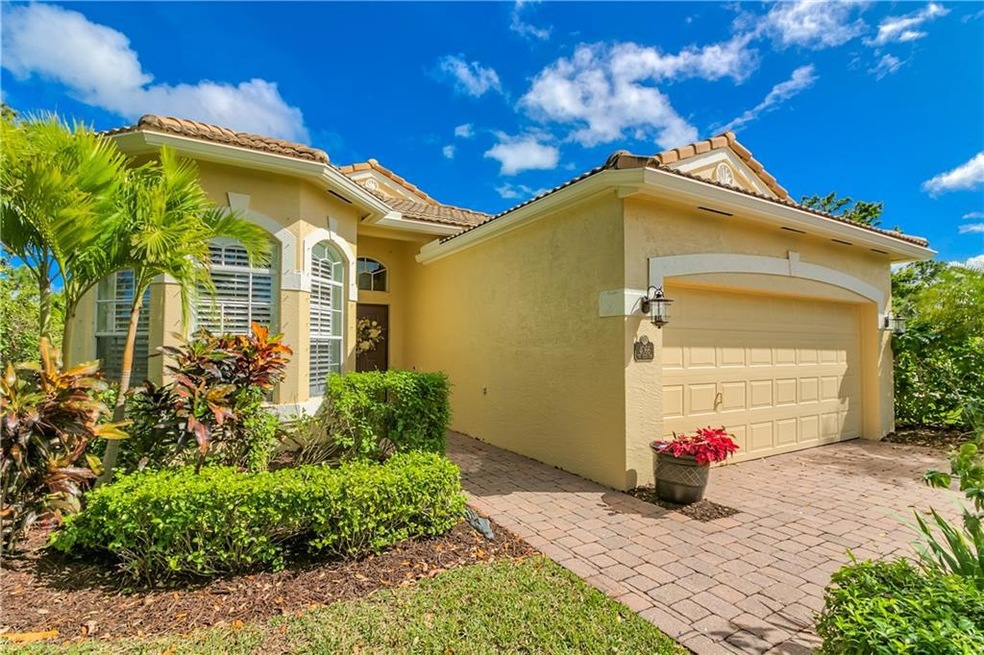 Concrete block construction w/ barrel tile roof and 2-car garage-