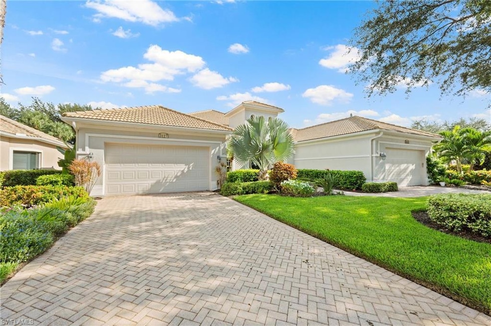 Mediterranean / spanish-style house with a front y