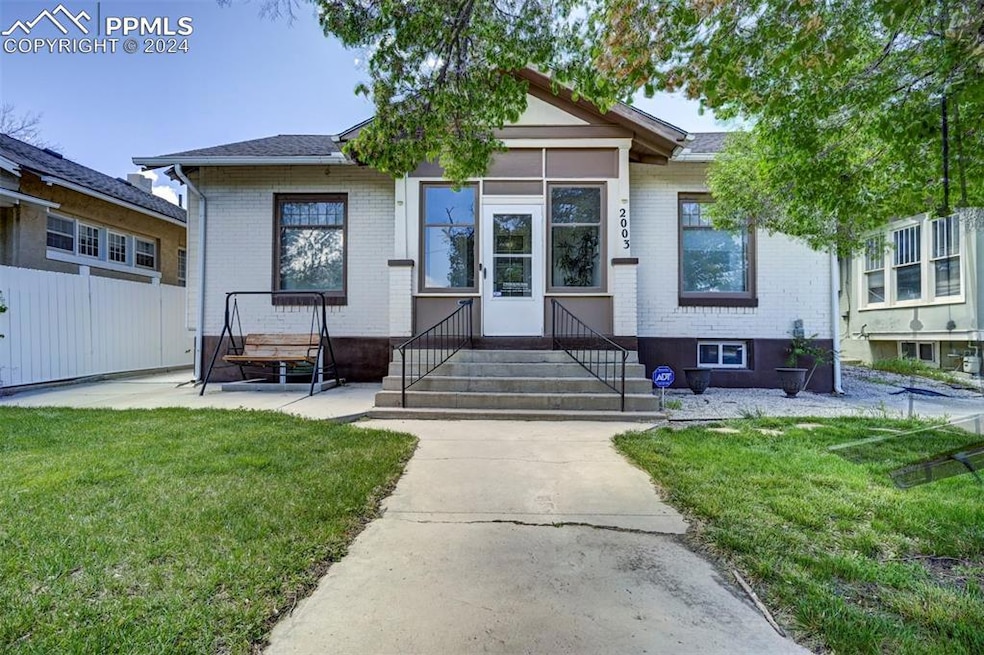 View of front of house featuring a front lawn