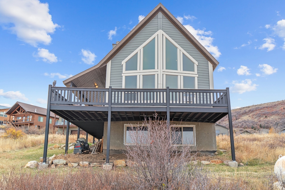 Back of property with a wooden deck
