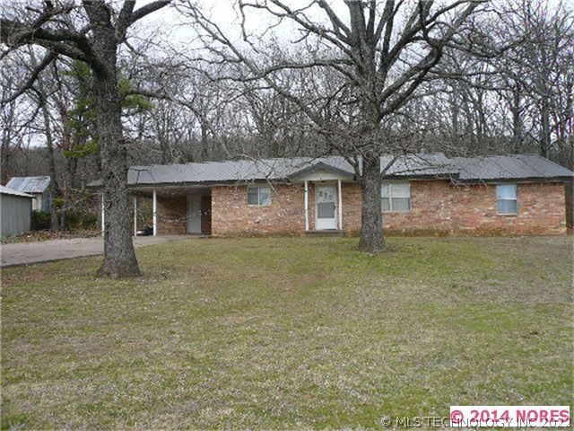 Full brick home with metal roof.