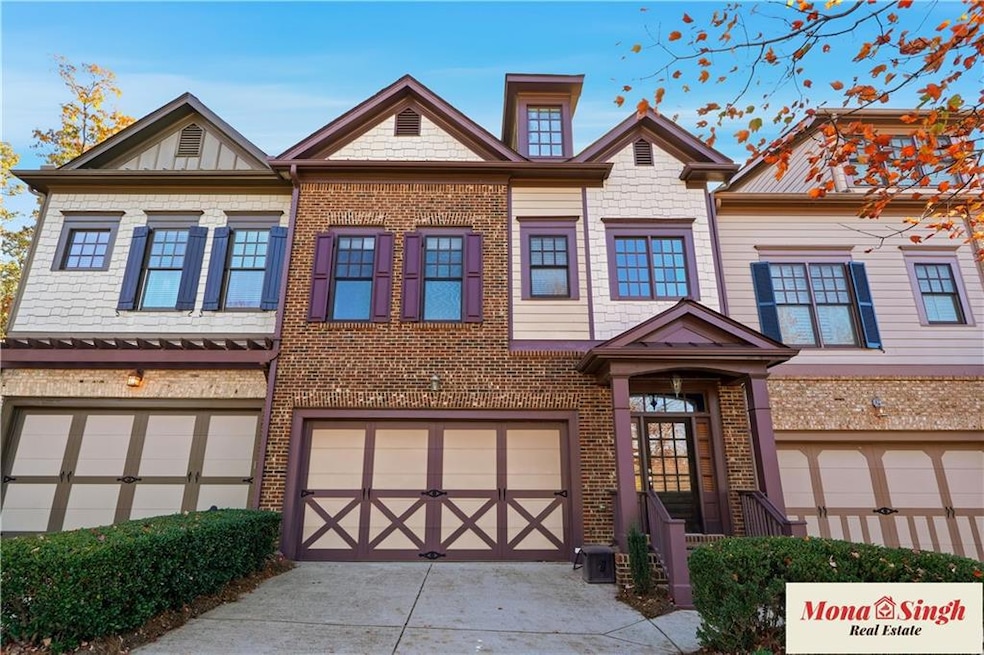Craftsman-style home with concrete driveway, a garage, and brick siding