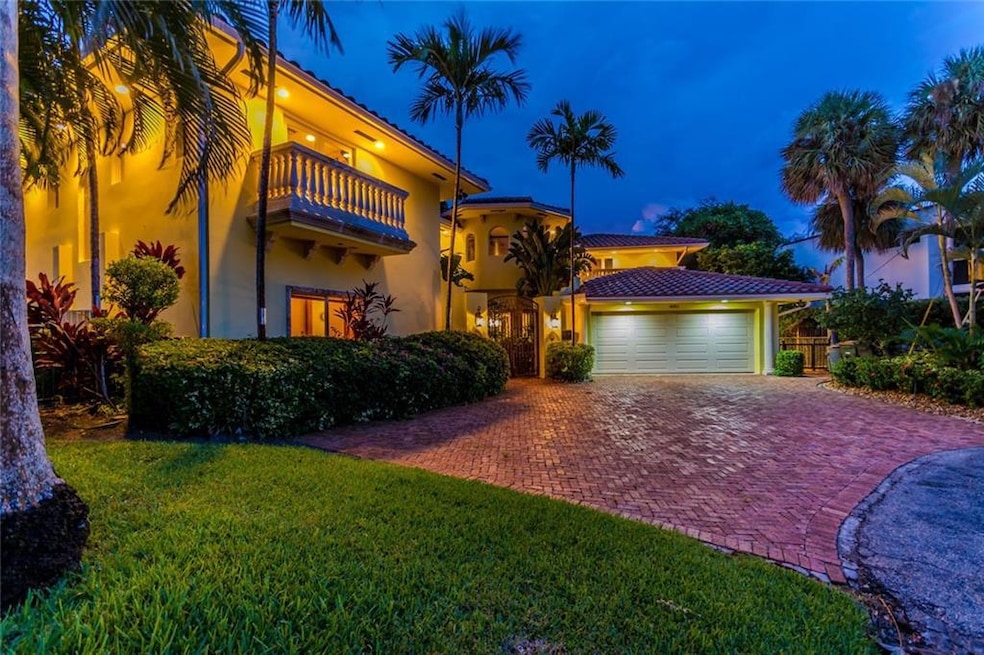 Pavered driveway, outdoor lighting, gorgeous home