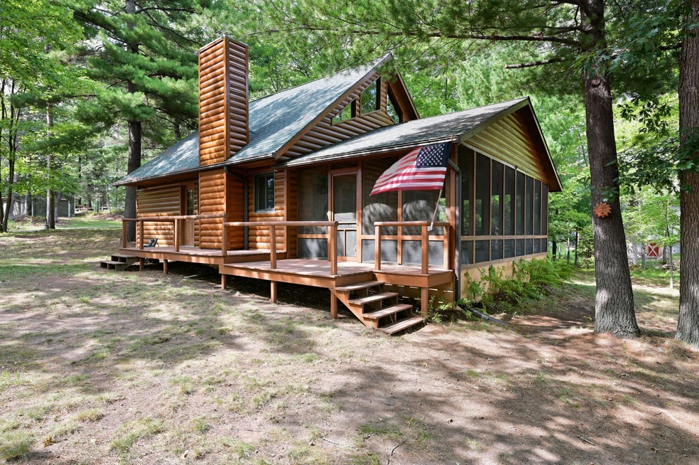 This log sided cabin on Fish Lake in Burnett County is just two hours away from the Minneapolis metro.