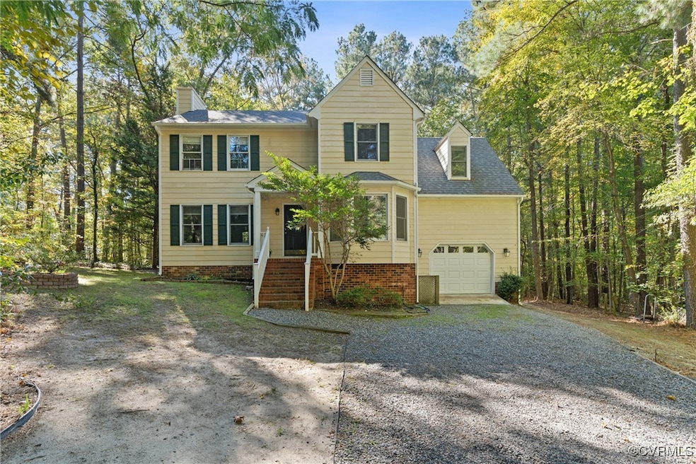 View of front facade featuring a garage