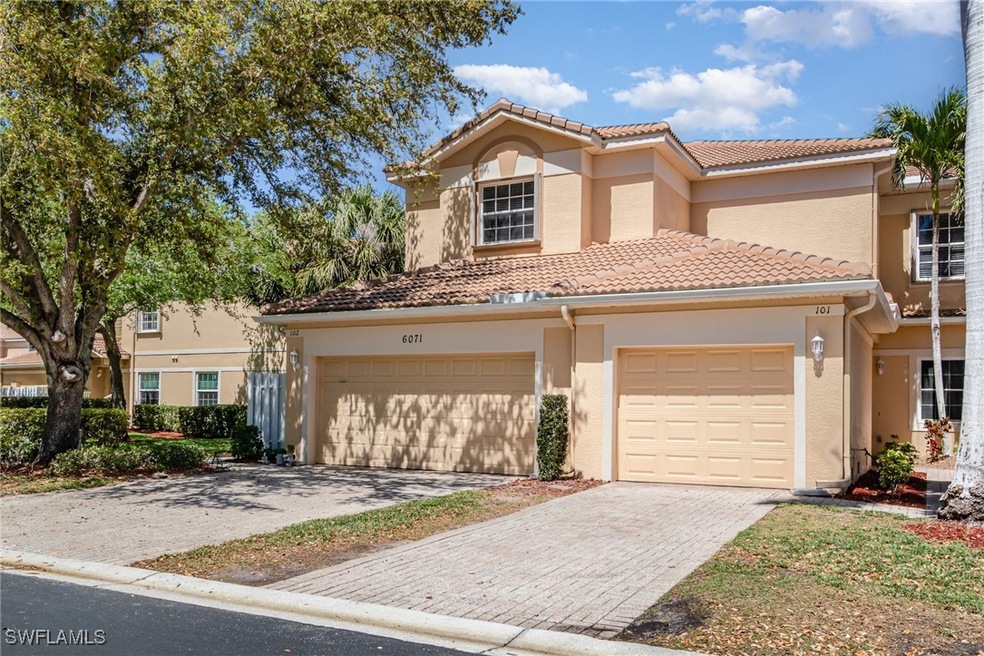 View of front of property featuring a tiled roof,