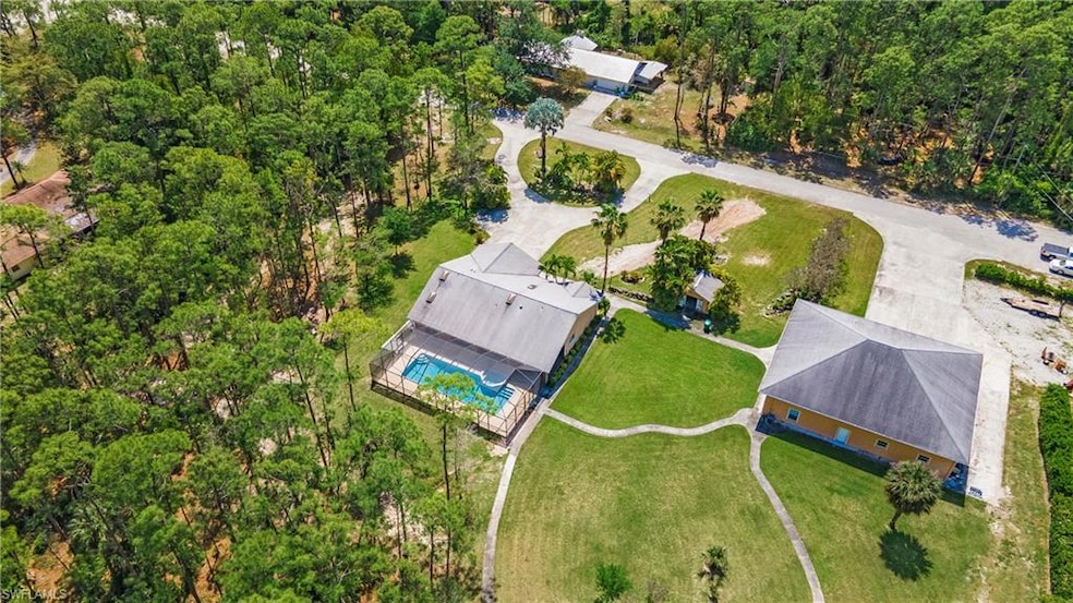 Aerial view of property showing circular driveway 