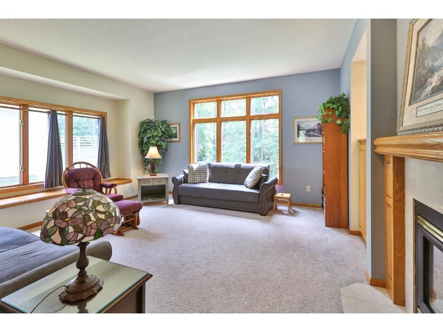 Spacious living area has high ceilings and large w