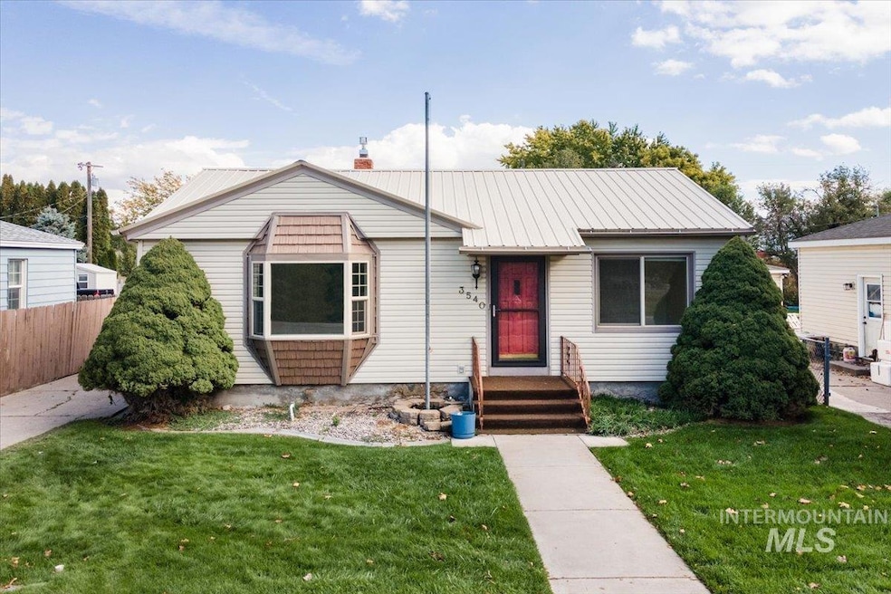 View of front of house featuring a metal roof