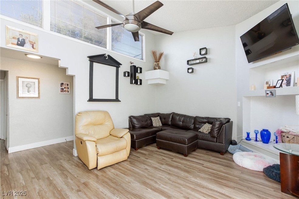 Living area featuring light wood-style flooring, a
