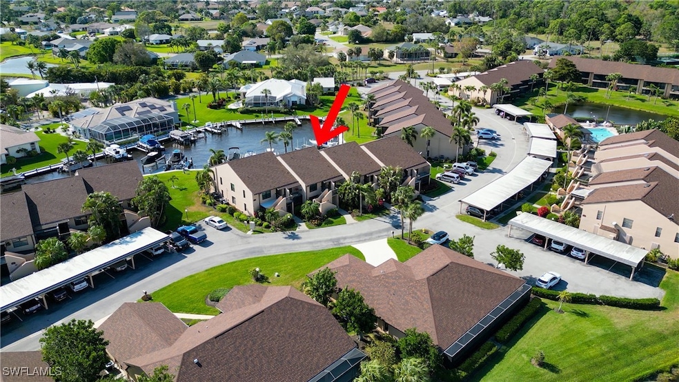 Aerial view with a water view and a residential vi