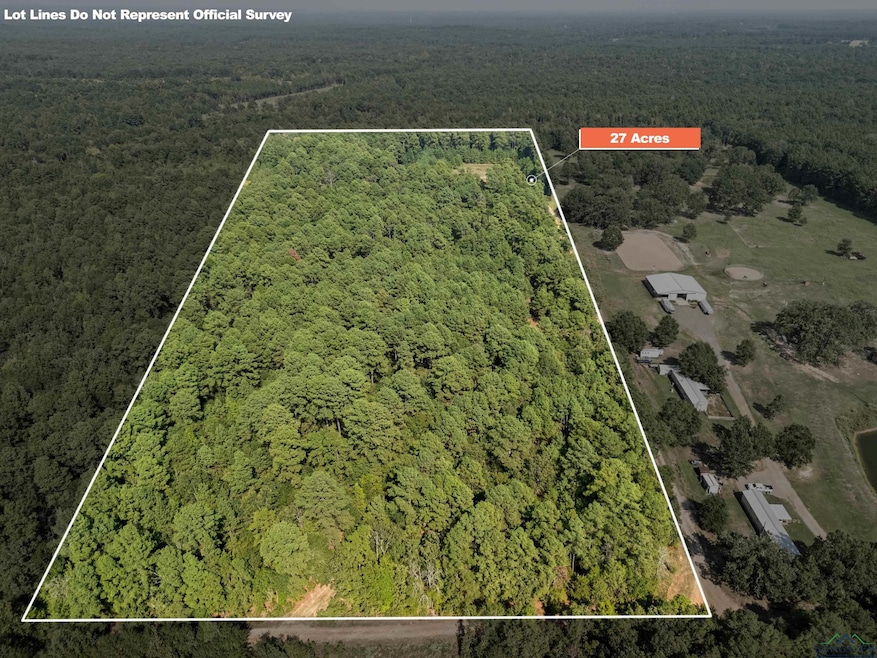 View of property location featuring a heavily wooded area and property parcel outlined
