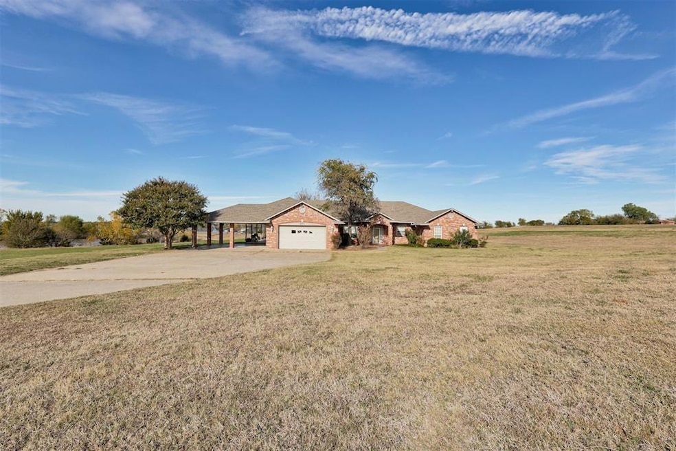 Single story home with an attached garage, drivewa