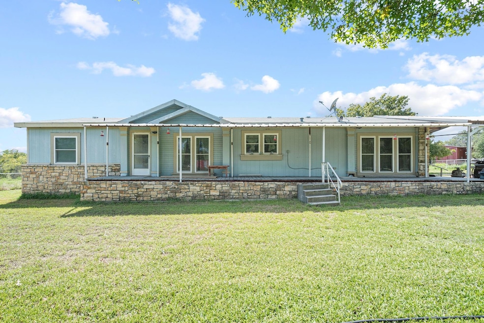 View of front of property with a front yard