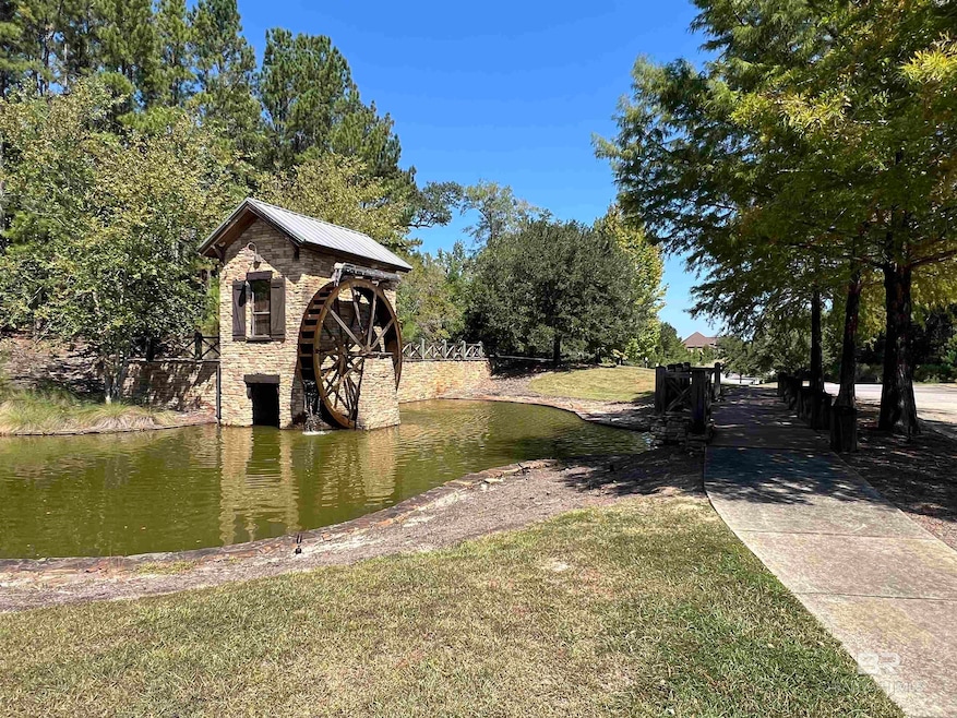 View of green lawn with a water view