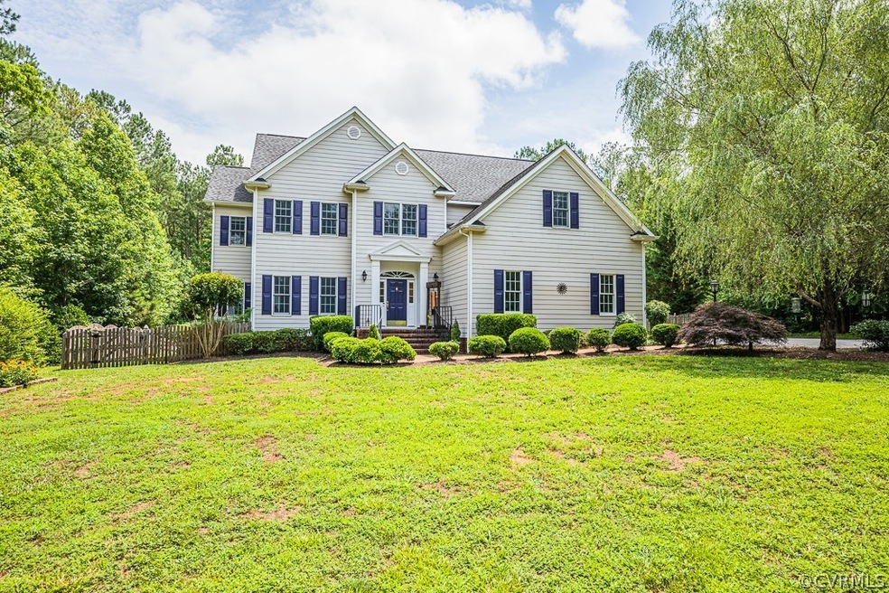 Beautiful vinyl sided home on private 3.04 acres in Mill Forest neighborhood in Goochland!