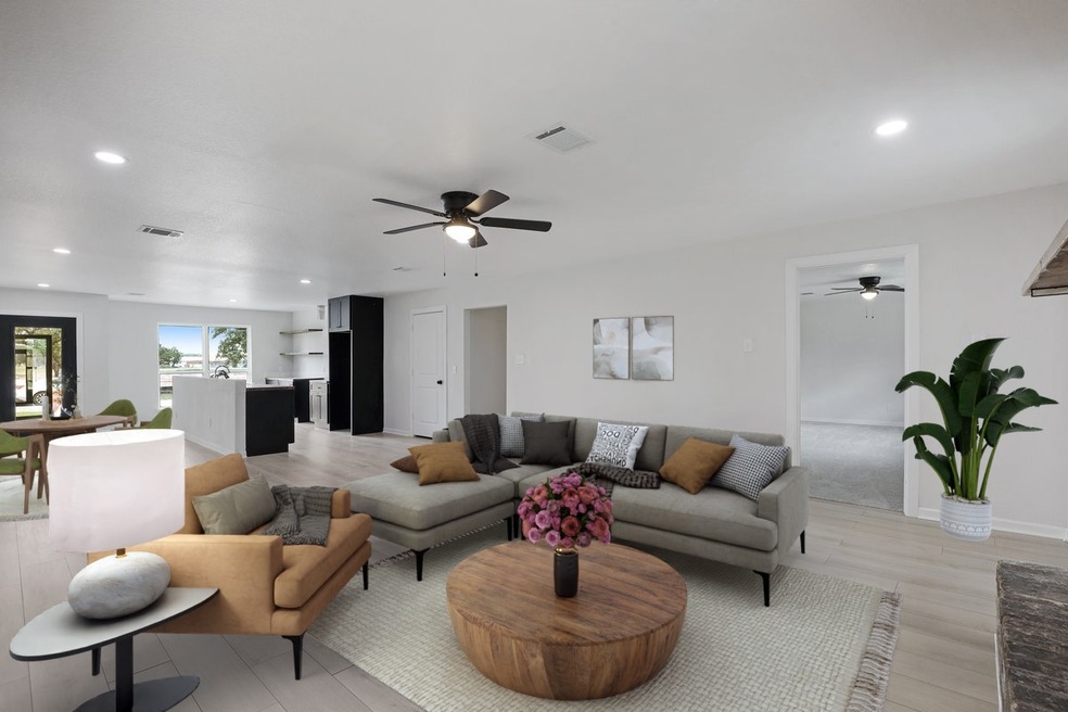 Virtually staged open-concept living room.