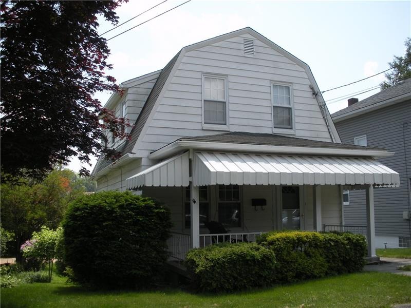 Beautifully landscaped exterior, shady front porch