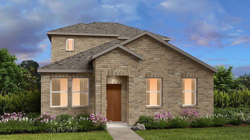 View of front of property featuring brick siding 