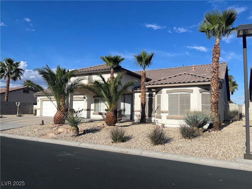 Mediterranean / spanish-style home with a garage,