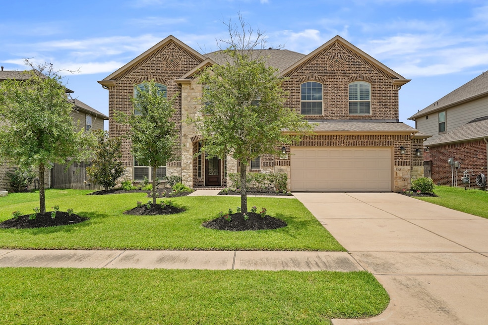 Welcome home to 13410 Coolidge Creek Drive located in the esteemed gated Wildwood at Northpoint community.