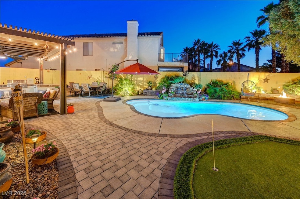 Pool at night featuring a putting area, a patio, a