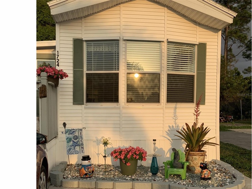 Front of home with bay window and decorative shutters