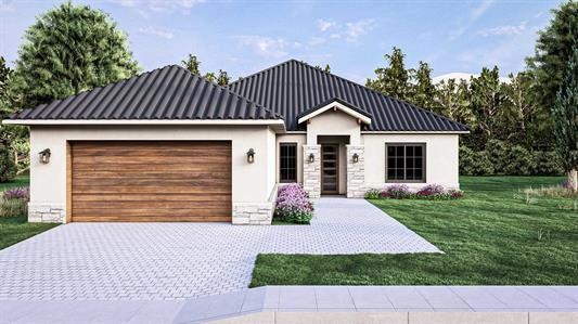 View of front of home featuring stone siding, stu
