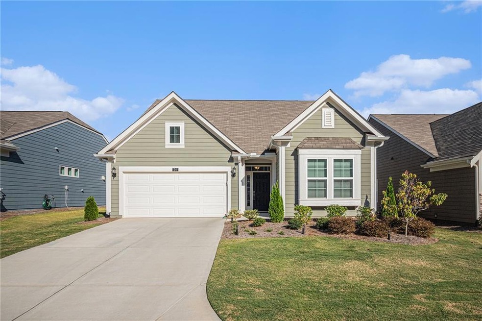 View of front of home featuring a garage and a fro