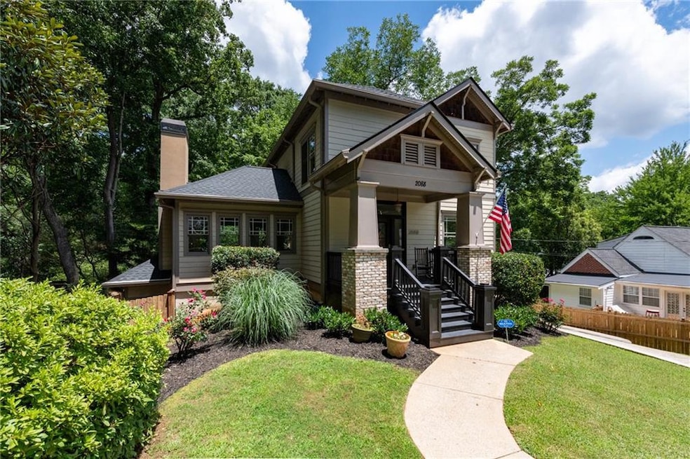 Craftsman-style home featuring a chimney and covered porch